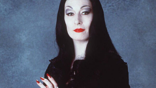 Anjelica Huston as Morticia Addams